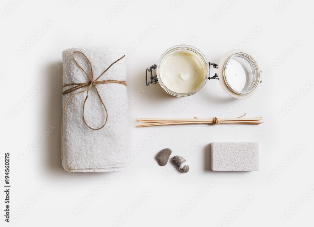Spa treatment and beauty products on white paper background. Flat lay. Spa treatment and beauty products on white paper background. Flat lay.