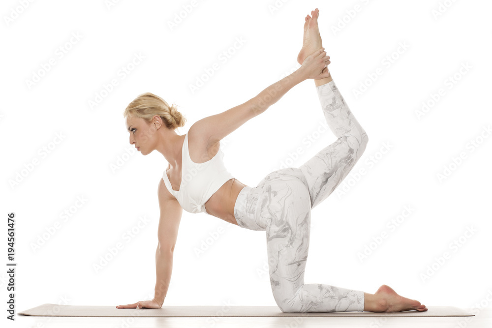 Young Woman Doing Half Bow Pose at Yoga Studio Stock Photo - Image of  studio, asana: 220751354