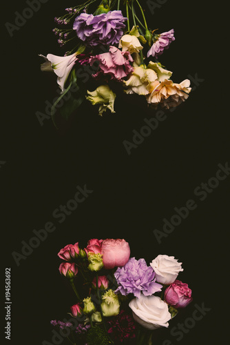composition of beautiful tender fresh blooming flowers isolated on black