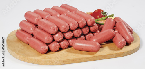cocktail frankfurters on a chopping board