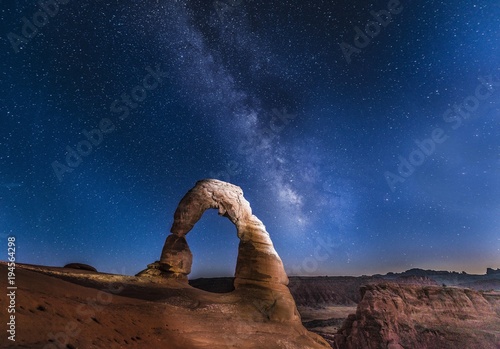 Natural Arch Delicate Arch with Milky Way at night, Arches National Park, Moab, Utah, USA, North America photo