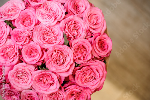 Top view photo of gorgeous bright pink roses