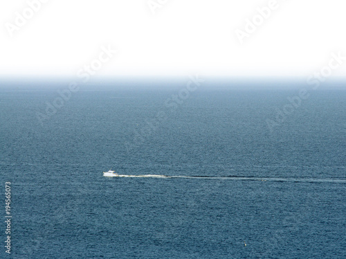 boat on the sea with empty white space above for text © Ioan Panaite