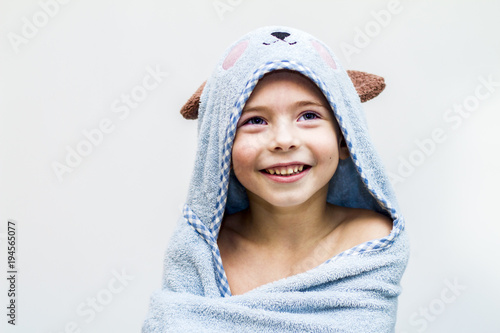 The boy in the towel, after the bath.