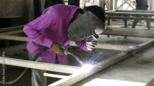 construction worker welding metal