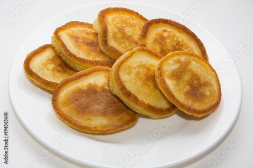 Homemade fritters on a white background.