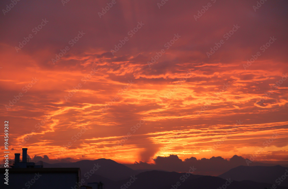 Sunset Mountain Secret has beautiful golden orange sky.