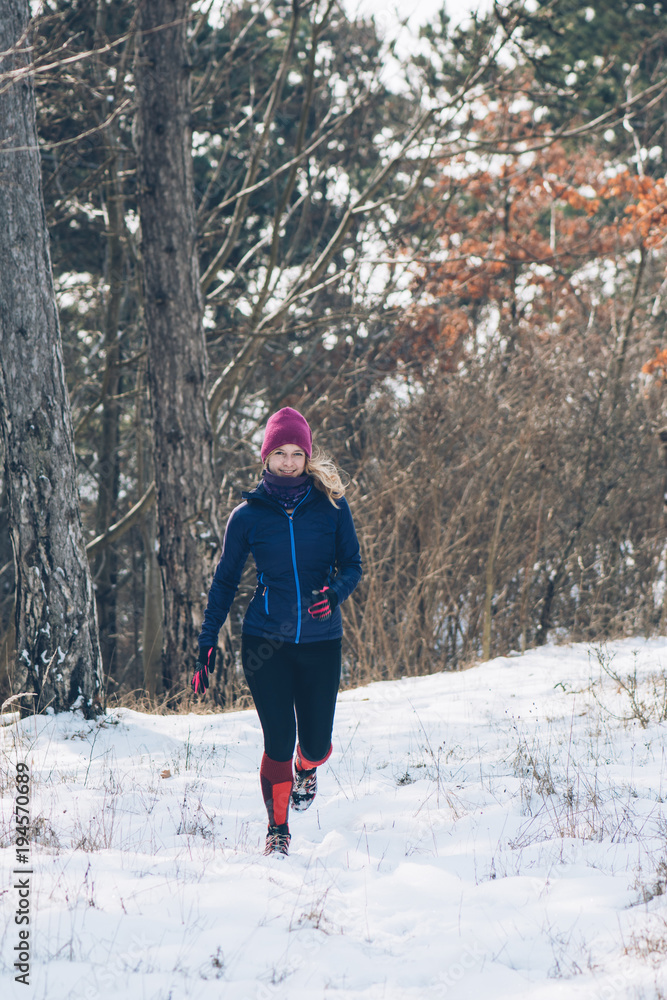 Running woman outdoor. Winter sport concept.