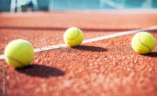 Tennis ball on the tennis court. Sport, recreation concept © bobex73