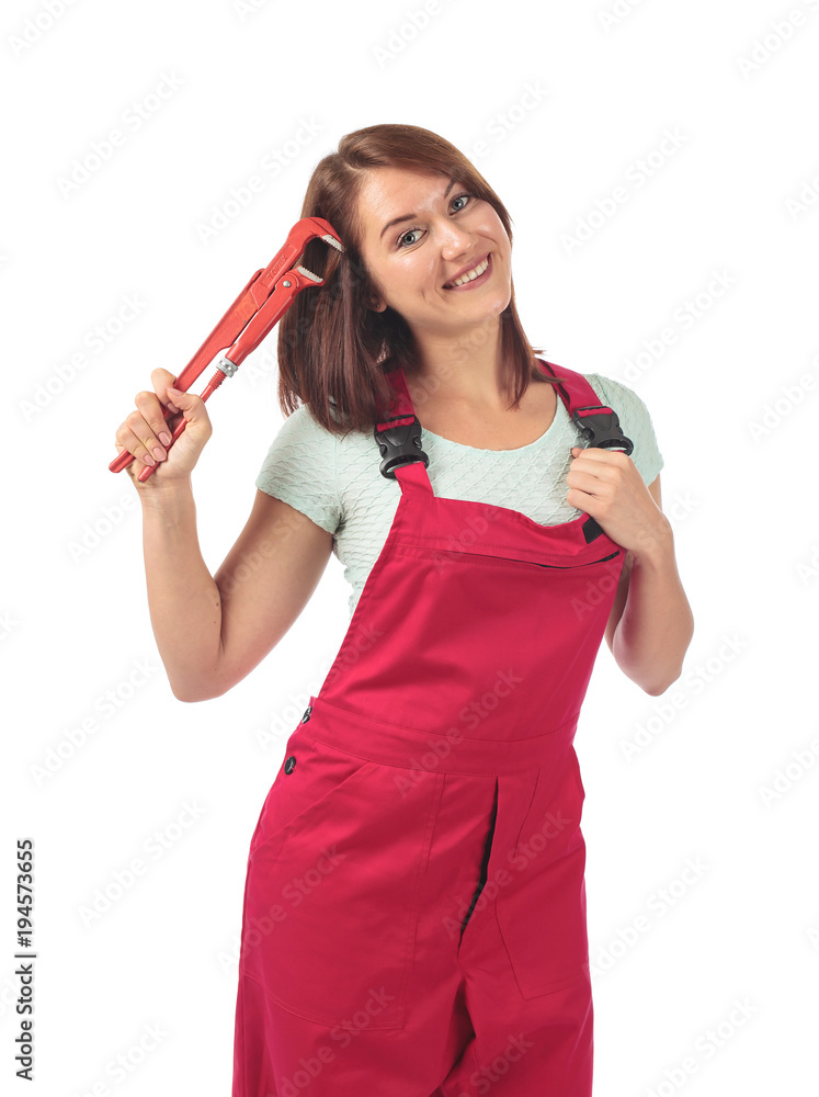 Young woman in red jumpsuit with wrench in hand, isolated on white . Young woman in red jumpsuit with wrench in hand, isolated on white .