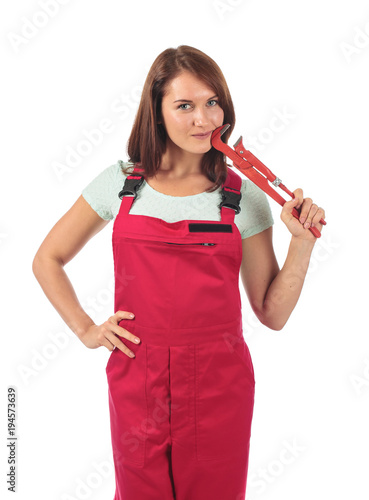 Young woman in red jumpsuit with wrench in hand, isolated on white .