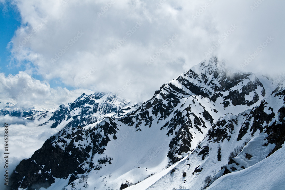 Fototapeta premium landscapes of the slopes of the mountains in the snow, something which is a forest