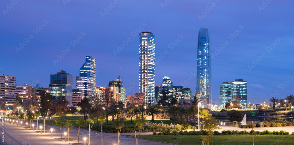 Fototapeta premium Skyline of Financial District at Providencia from Parque Bicentenario (Bicentennial Park) in Vitacura district, Santiago de Chile, South America