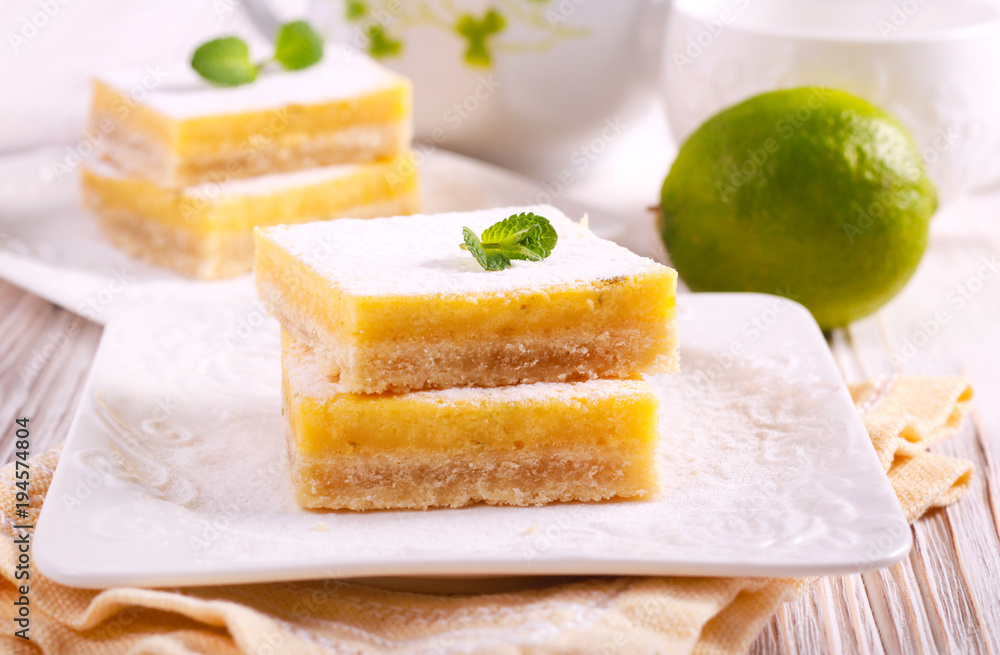 Lime cooler bars with icing sugar