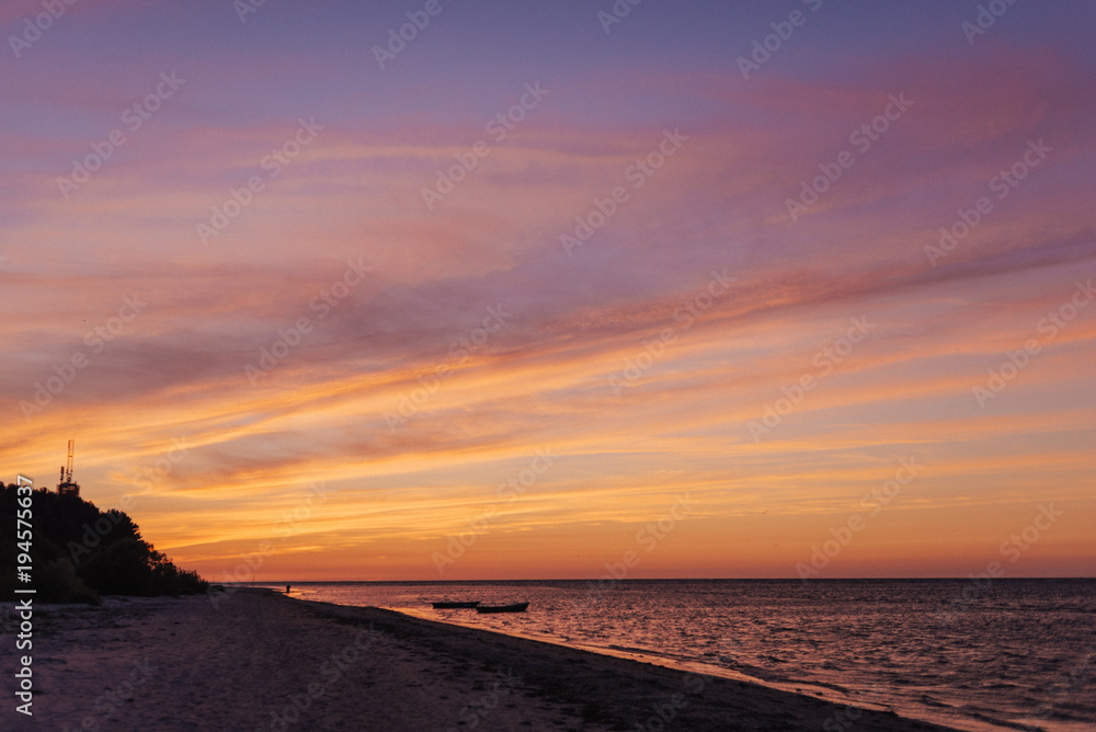 Colorful cloudscape after sunset on the beach. Latvia