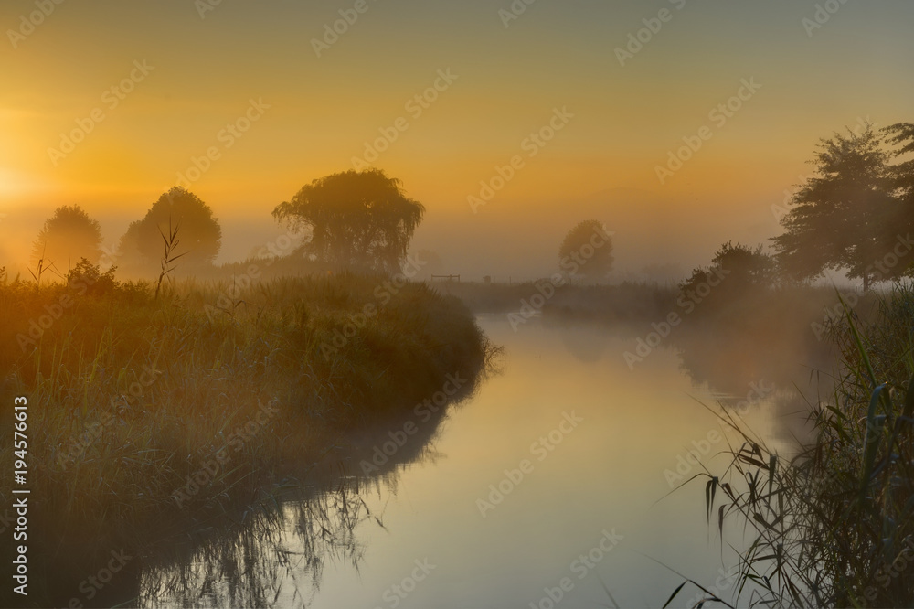 Fototapeta premium MISTY TWILIGHT. dawn light on mists rising off the Umzimkulwana River, Underberg, South Africa