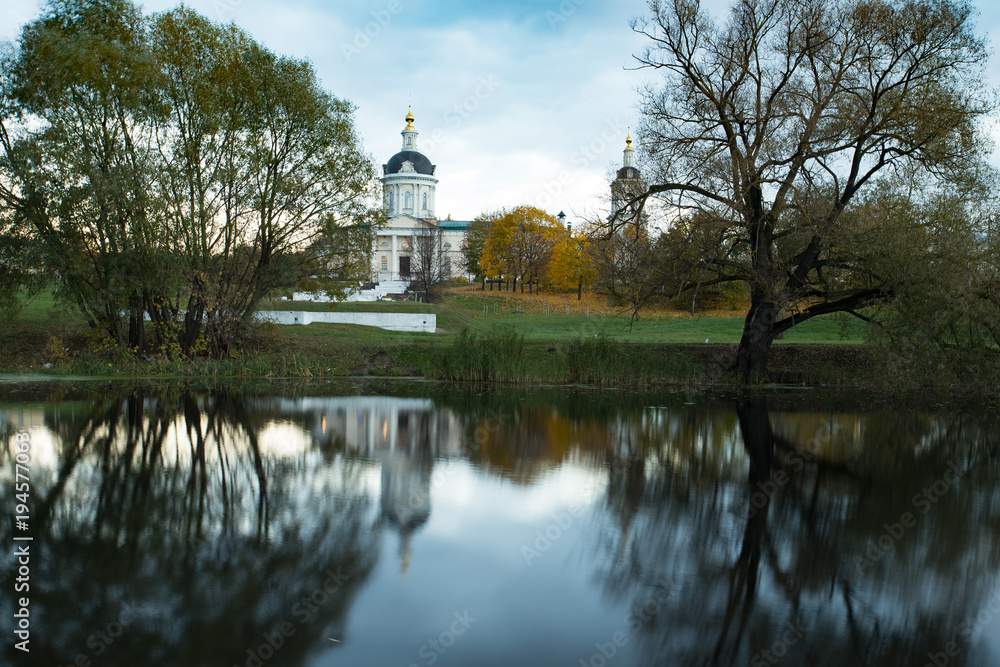 Kolomna, Moscow Region, Russia. Church Of Michael Archangel By River Kolomenka With Reflection At Autumn.