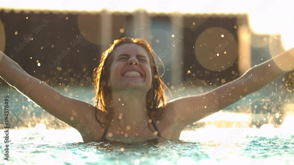 Woman enjoying the water drops falling on her สต็อกวิดีโอ | Adobe Stock