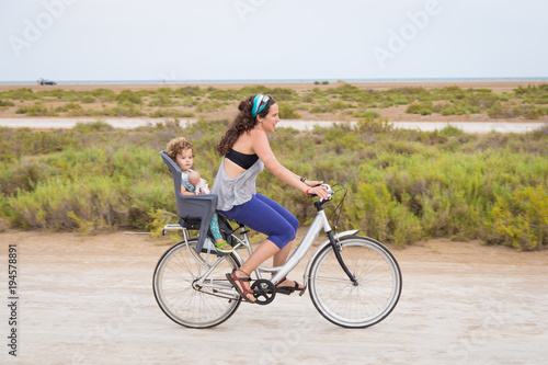 Woman riding with a toddler