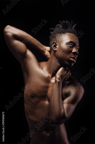 portrait of African-American man on black background