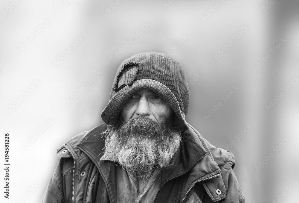 Portrait of a beggar with dirty and unkempt beard and mustache  