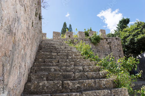 Old stone staircase leads up to the park