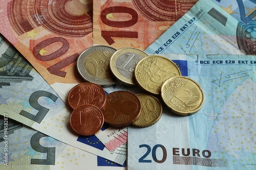 Different typs of euro coins on different typs of euro banknotes