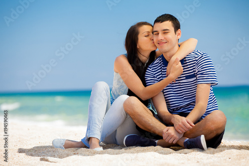 in love couple on the sea beach in summertime.