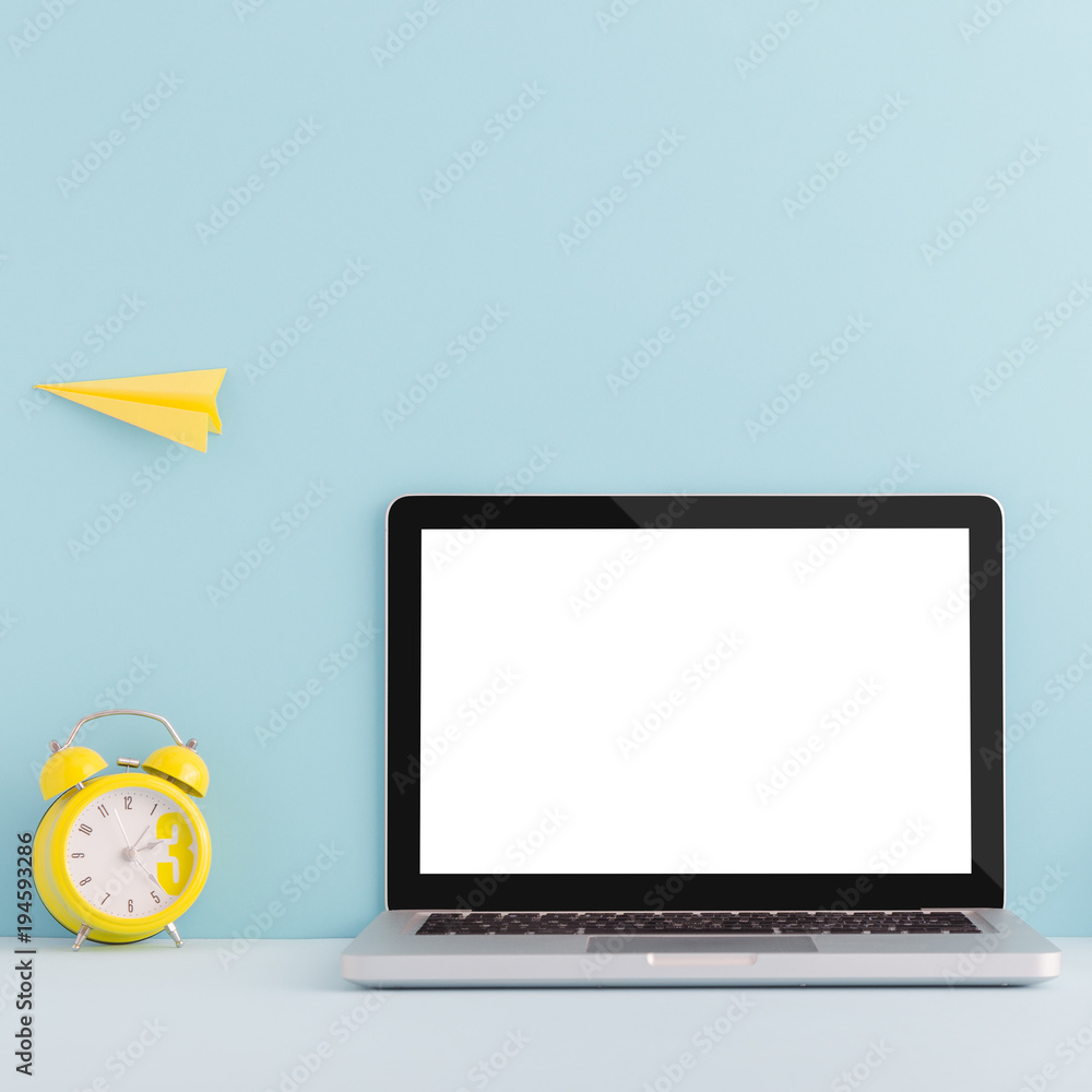 Laptop and alarm clock on blue background. Back to school mock up... Laptop and alarm clock on blue background. Back to school mock up...