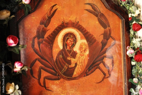 The icon of Panagia Kavouradena (rare painting of Virgin Mary with a giant crab as backgound) in Ksirokambos, Leros island, Dodecanese islands, Greece. photo