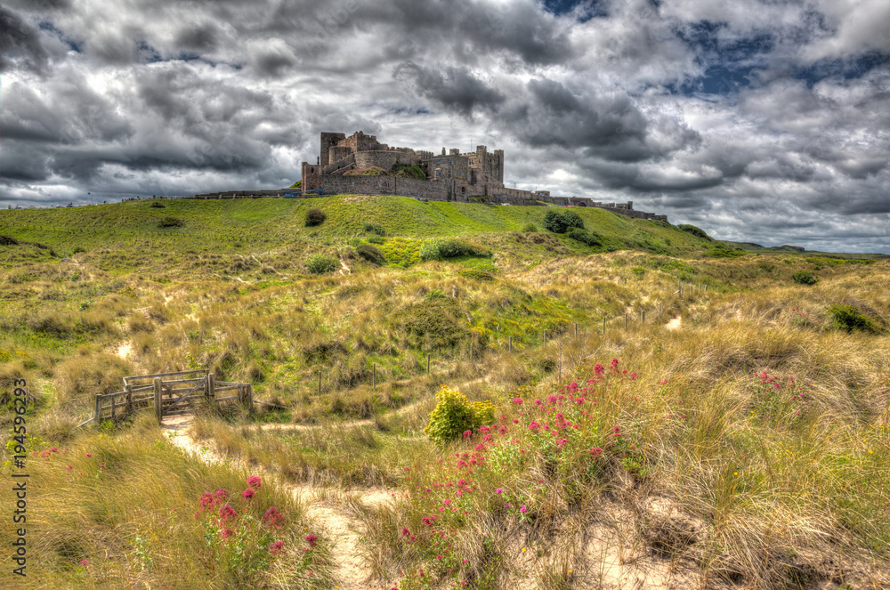 Bamburgh castle on a hill Northumberland north east England UK in hdr