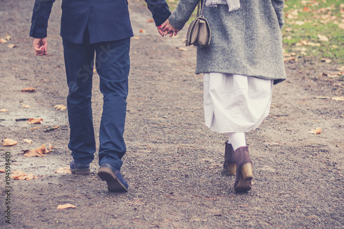 Couple in love walking and holding hands