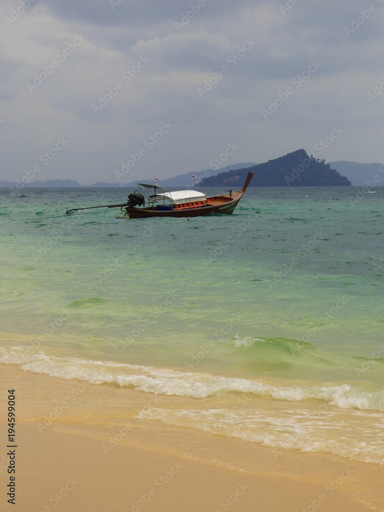Long tail boat at School beach on Koh Bulon, island in the Adaman sea