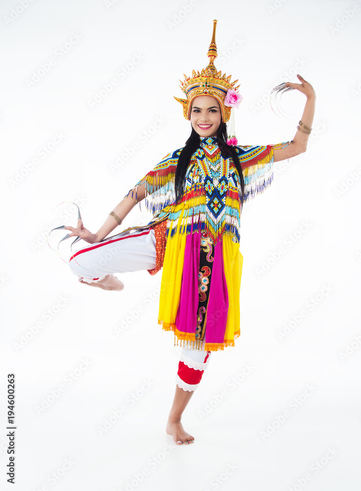 The lady in Southern thai classical dancing suit is posing on white background.