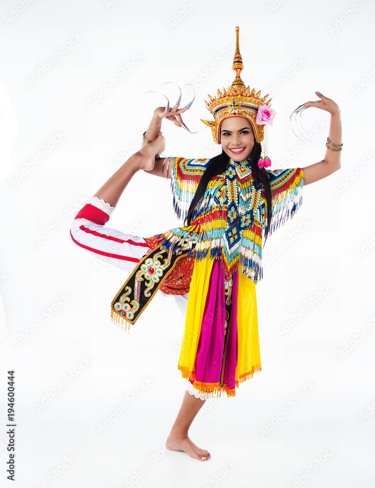 The lady in Southern thai classical dancing suit is posing on white background. The lady in Southern thai classical dancing suit is posing on white background.