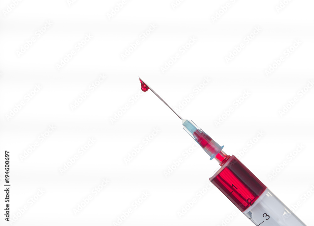 Syringe with a drop of blood on a needle on a white background Syringe with a drop of blood on a needle on a white background
