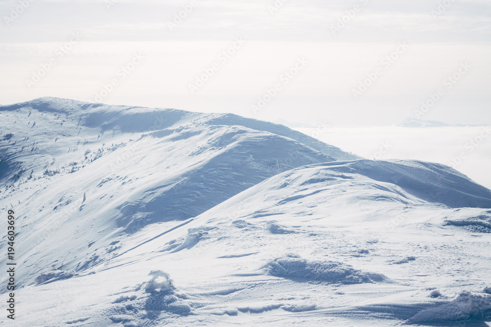 View of white Gorgany mountains and cloudy sky