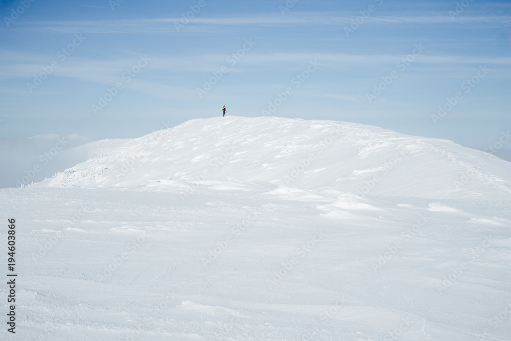 Alone climber standing on hill in Gorgany mountains