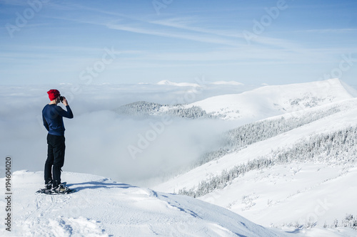 Man drinking from cup on top of Carpathian mountains © LIGHTFIELD STUDIOS