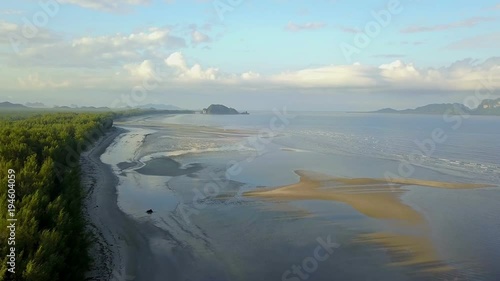 An unspoilt beach of Pak meng, Sikao District, Trang Province, Thailand. A natural beauty of crystal clear sea water, white sandy beach and distant islands located at Southern Thailand photo