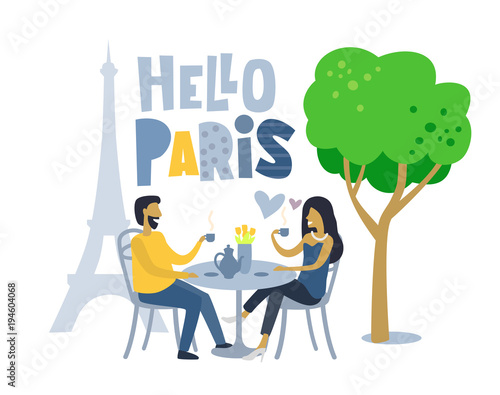 Couple siting at parisian cafe.