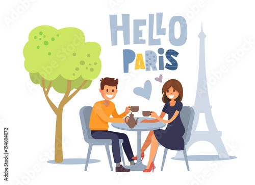 Couple siting at parisian cafe.