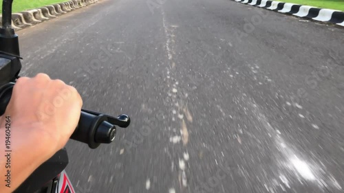 Riding scooter. Woman on motorbike. Asian road. 4K motion video.