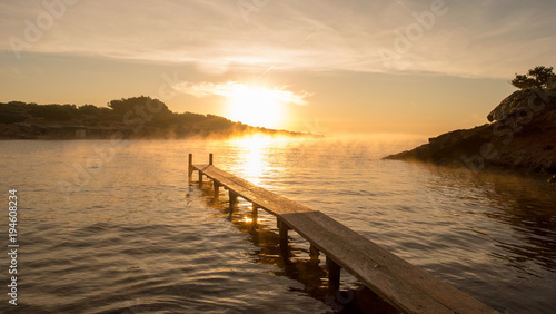 Sespanyol Beach in Ibiza at sunrise, Balearic Islands © vicenfoto