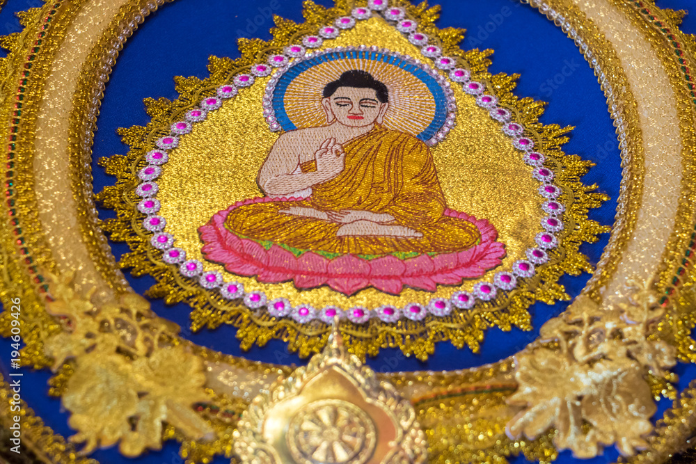 Decoration with sitting Buddha at talipot fan close up Buddhist temple Asokaram, Thailand