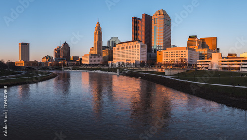 Columbus Ohio skyline at John W. Galbreath Bicentennial Park at orange dusk photo