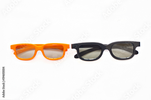 3d glasses in orange and black frames on a white background