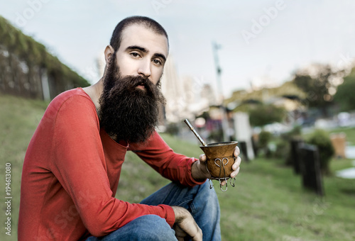 Bearded guy with mate in park photo