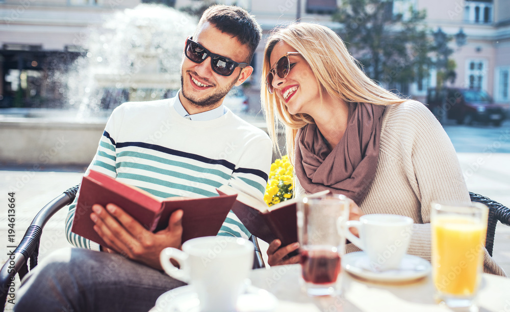 Dating. Young couple drinking coffee in the cafe. Education, relationships, love, lifestyle concept Dating. Young couple drinking coffee in the cafe. Education, relationships, love, lifestyle concept