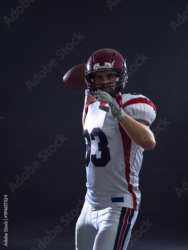 american football player throwing ball